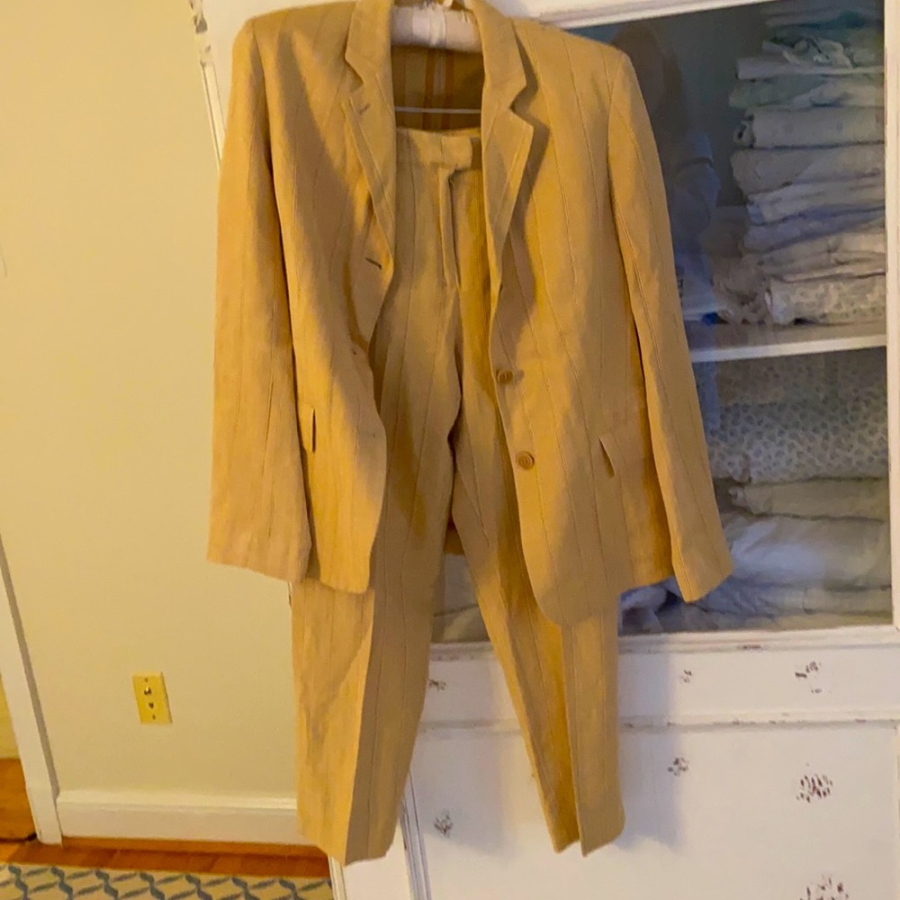 Silk/linen/cotton pinstripe jacket and trousers. Trousers are flat front.